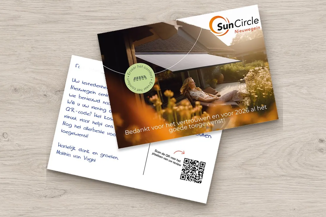 Pen-written card from a blinds and awnings company with a QR code, next to the front of the card showing a photo of an interior with blinds