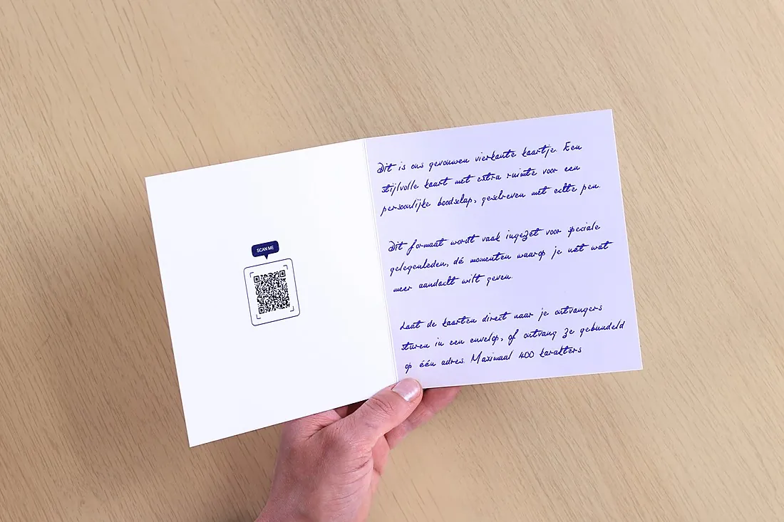 Unfolded square card with a QR code on the left and handwritten text on the right